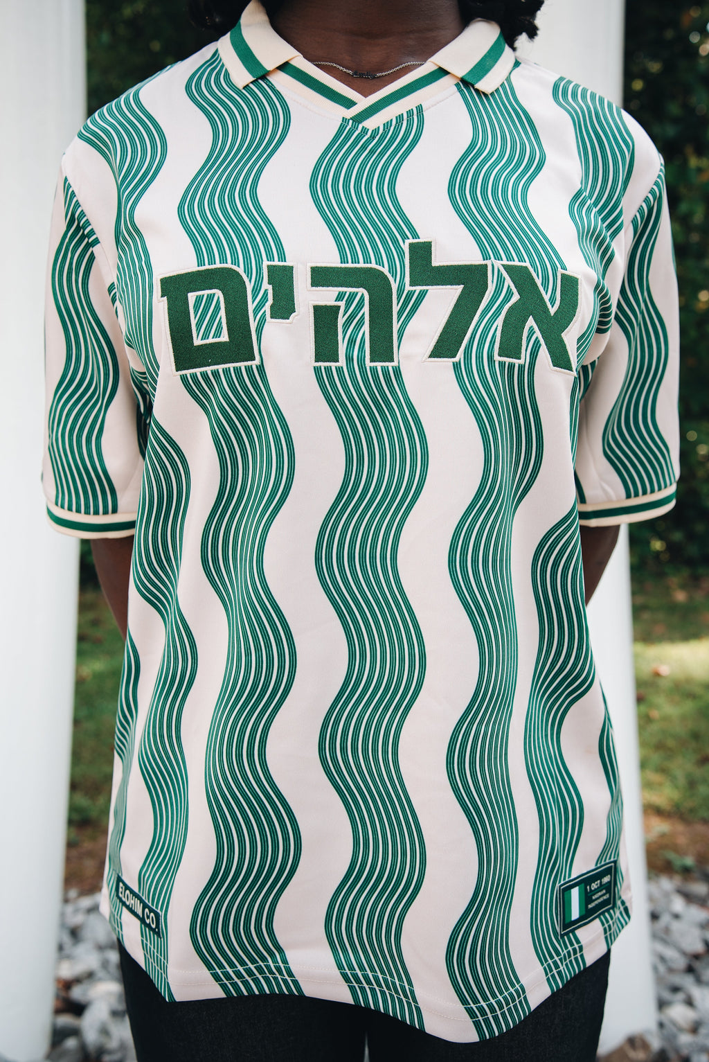 Heritage Jersey — close-up front view with Hebrew lettering and both commemorative patches