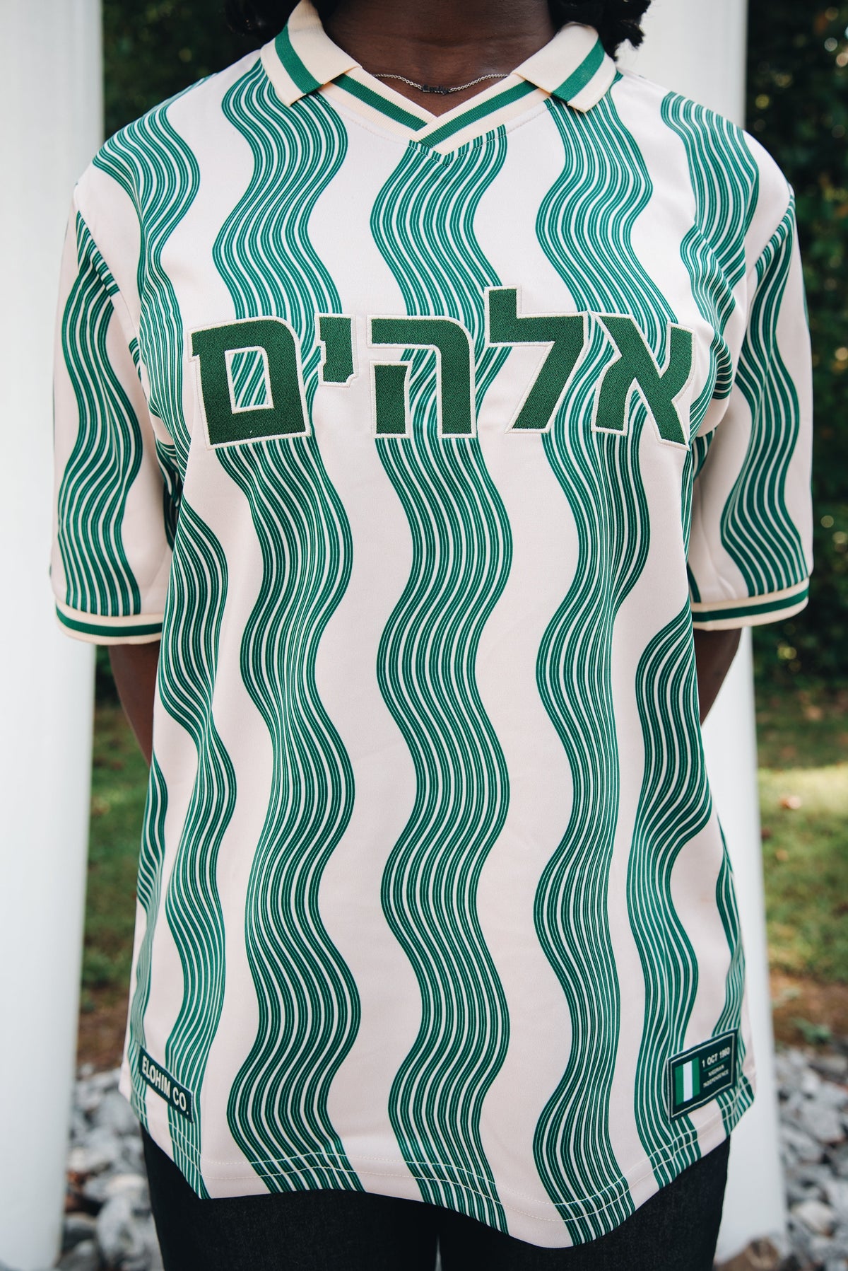 Heritage Jersey — close-up front view with Hebrew lettering and both commemorative patches